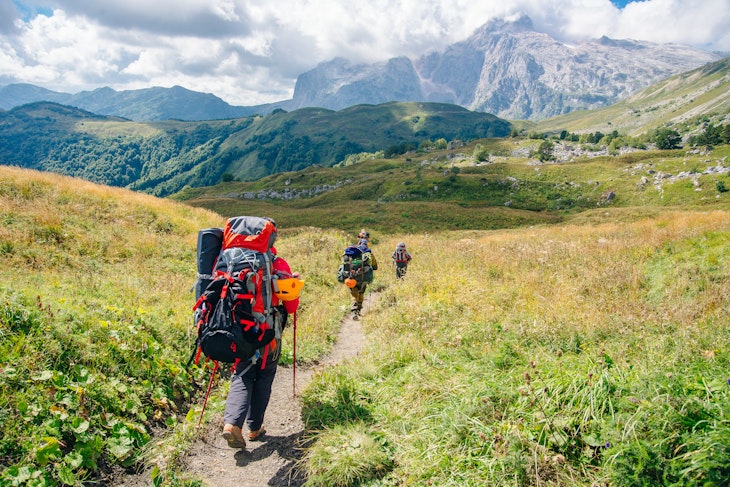 Group hiking in the Mountains of Republic of Adygea with large backpacks. Russia; Shutterstock ID 1660636402; your: Brian Healy; gl: 65050; netsuite: Lonely Planet Online Editorial; full: 7 years to walk the globe
1660636402