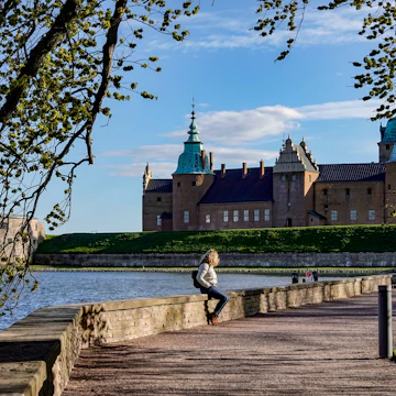 Kalmar, Sweden May 10, 2020 A woman sits on a wall on the grounds of the Kalmar Castle.; Shutterstock ID 1728247585; your: Sloane Tucker; gl: 65050; netsuite: Online Editorial; full: POI
1728247585
