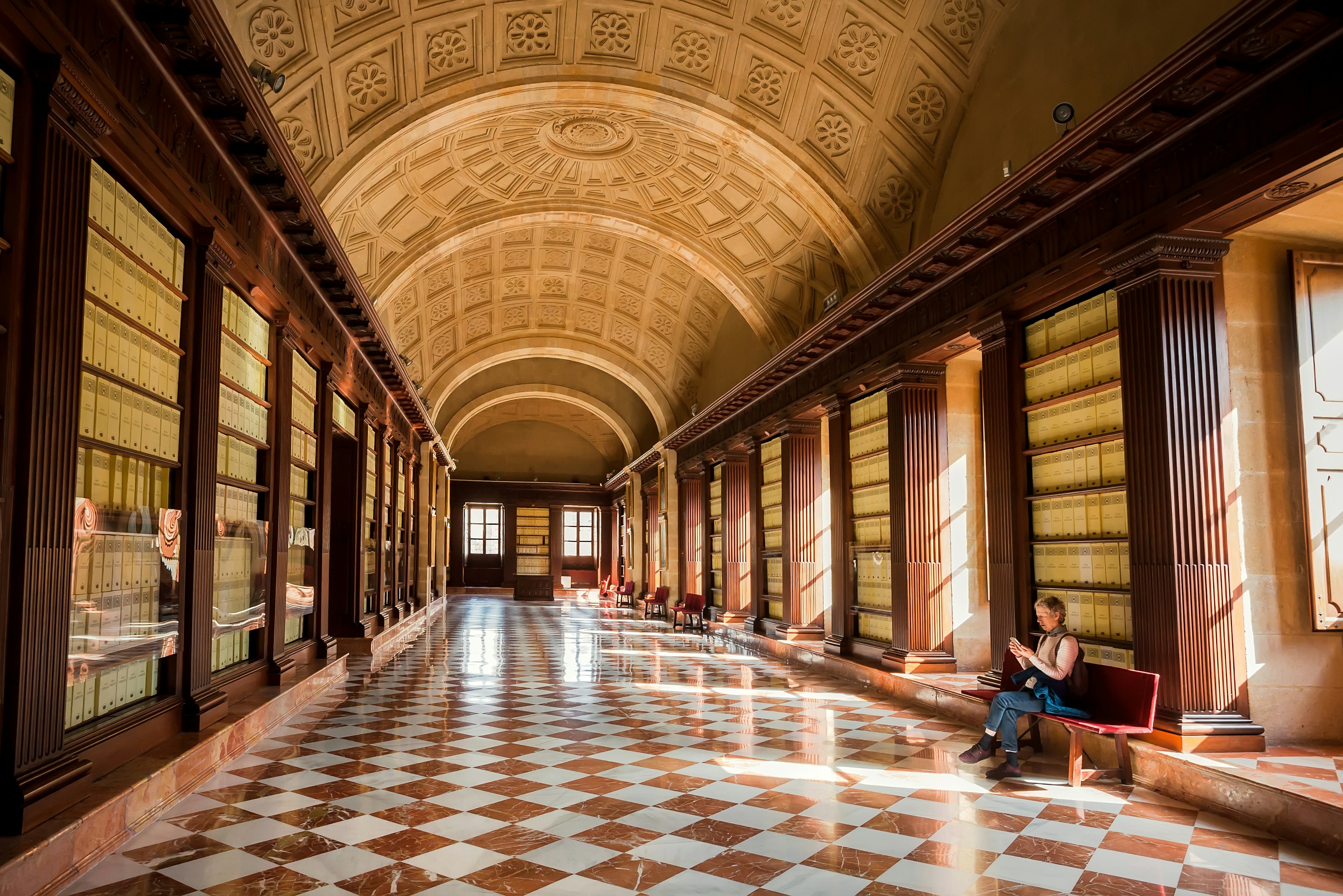 A visitor at the Archivo General de Indias in Seville, a fine example of Spanish Renaissance architecture.