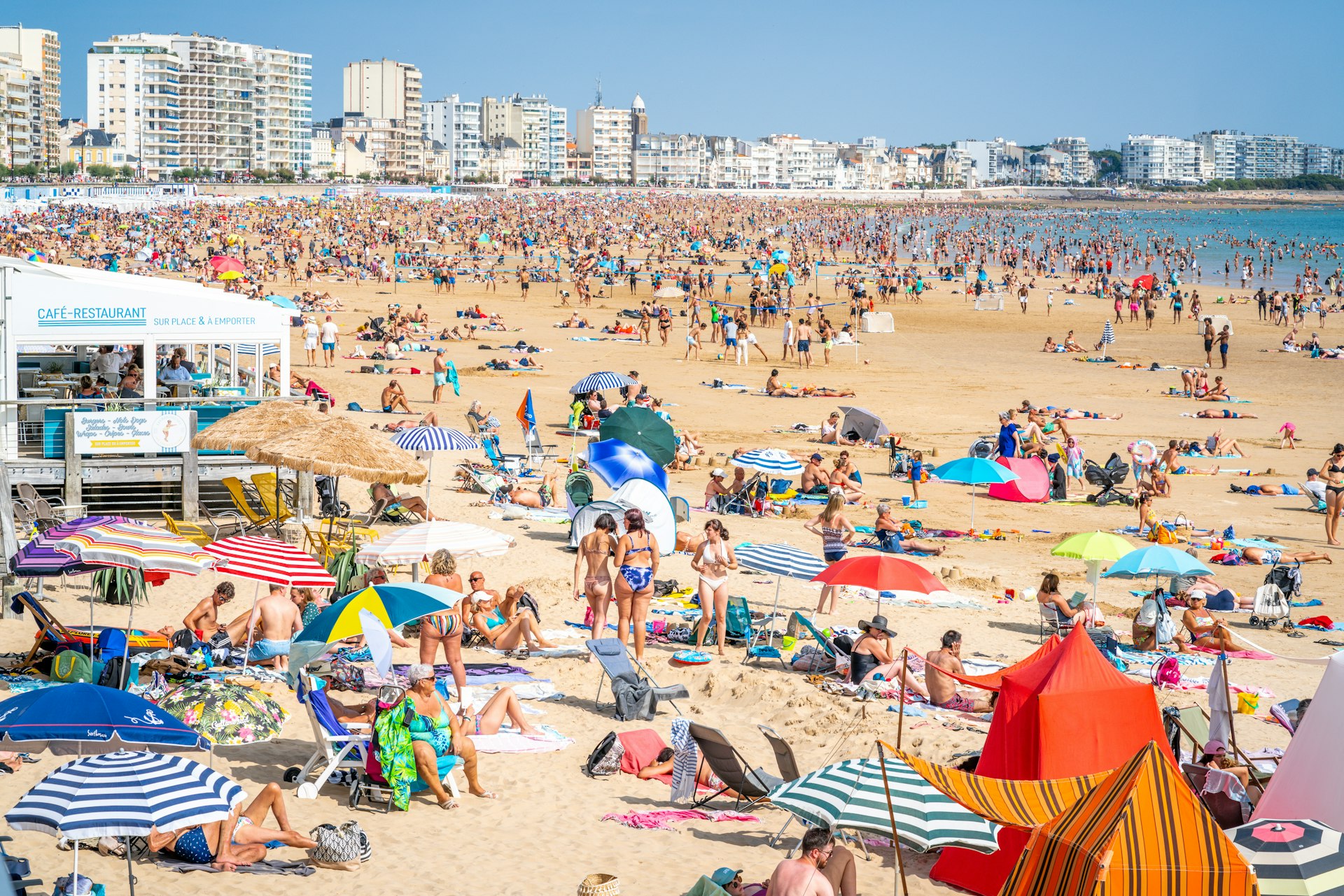 View of La Grande Plage beach of Les Sables d’Olonne crowded with people during summer 2021