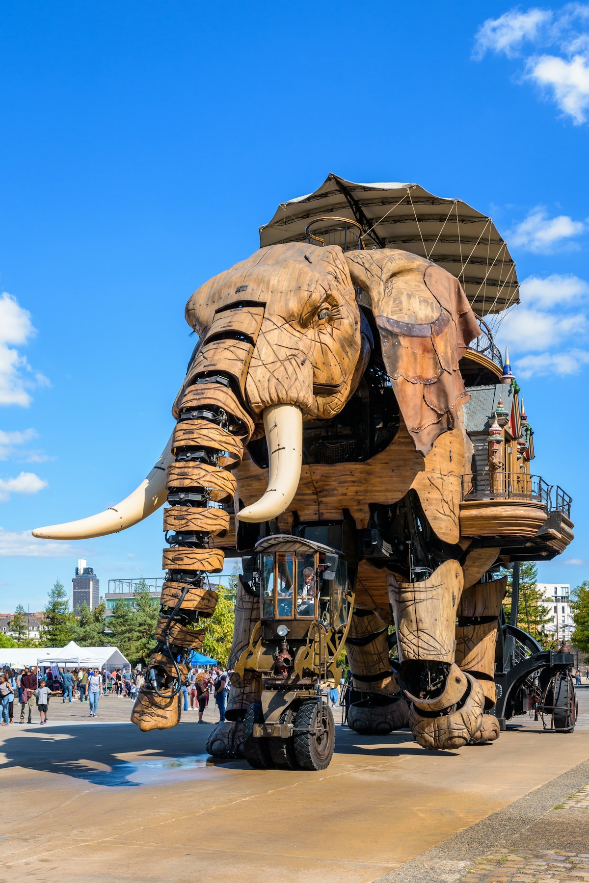 Nantes, France - September 17, 2022: The Great Elephant animated giant puppet, part of the Machines of the Isle of Nantes artistic and tourist attraction, wanders slowly amid onlookers on a sunny day.; Shutterstock ID 2220543875; your: Sloane Tucker; gl: 65050; netsuite: Online Editorial; full: POI
2220543875