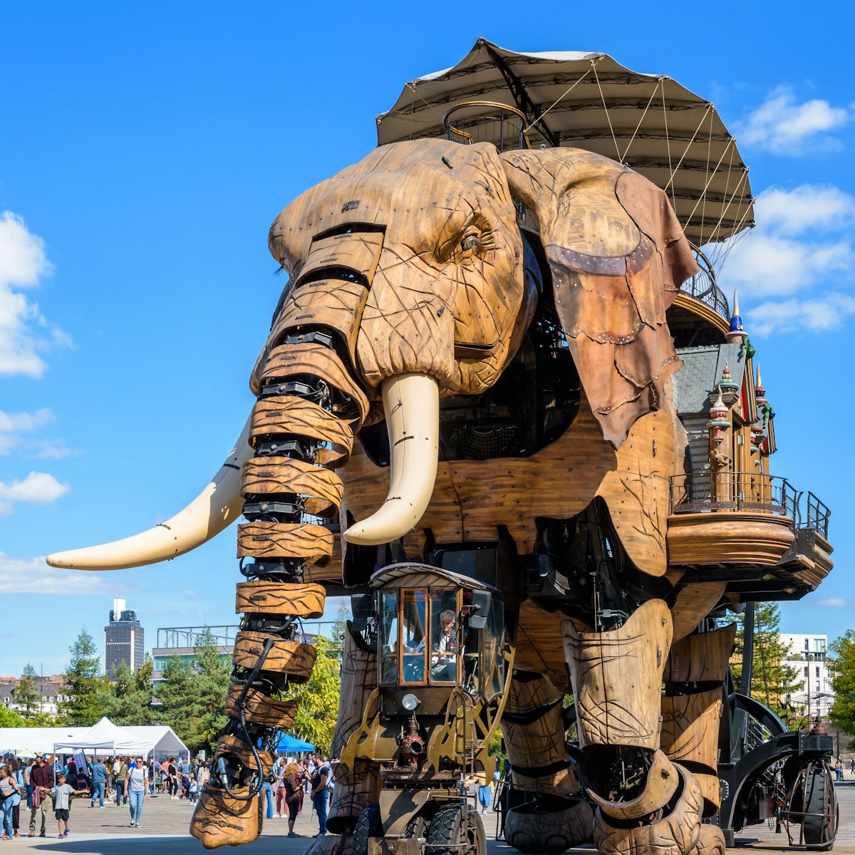 Nantes, France - September 17, 2022: The Great Elephant animated giant puppet, part of the Machines of the Isle of Nantes artistic and tourist attraction, wanders slowly amid onlookers on a sunny day.; Shutterstock ID 2220543875; your: Sloane Tucker; gl: 65050; netsuite: Online Editorial; full: POI
2220543875