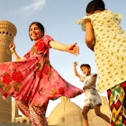 BUKHARA, UZBEKISTAN-CIRCA MAY 2008:Children dancing in the background of the old town
398424403