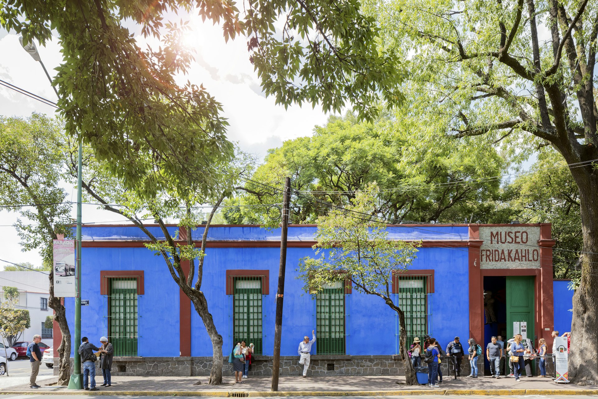 People outside of the Blue House (La Casa Azul), a historic house and art museum dedicated to the life and work of Mexican artist Frida Kahlo
