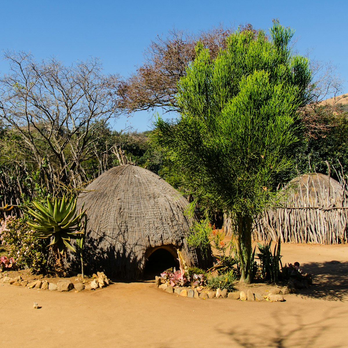 Traditional Swazi Beehive huts and fences in Mantenga Swazi Cultural Village, Swaziland.