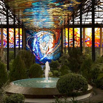 Cosmovitral Botanical Garden in Toluca, Mexico is surrounded by stained glass.