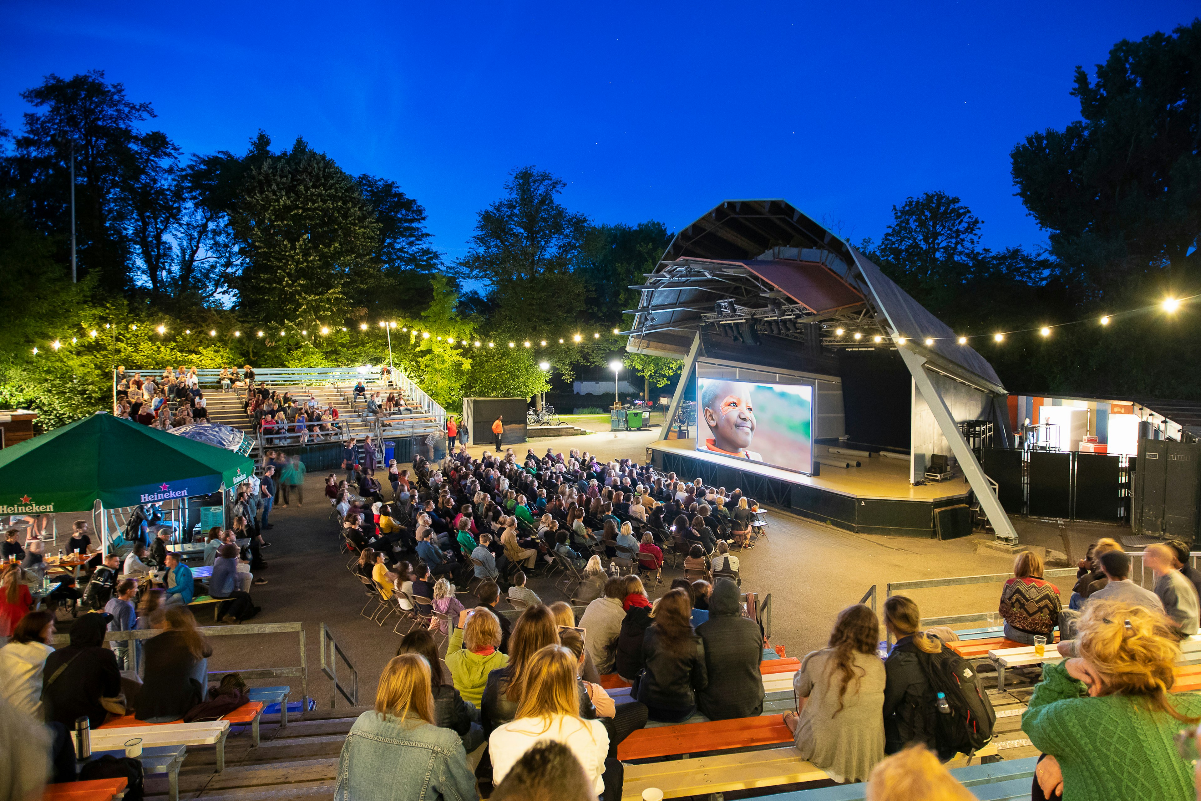 People at an open-air screening of Kenyan film