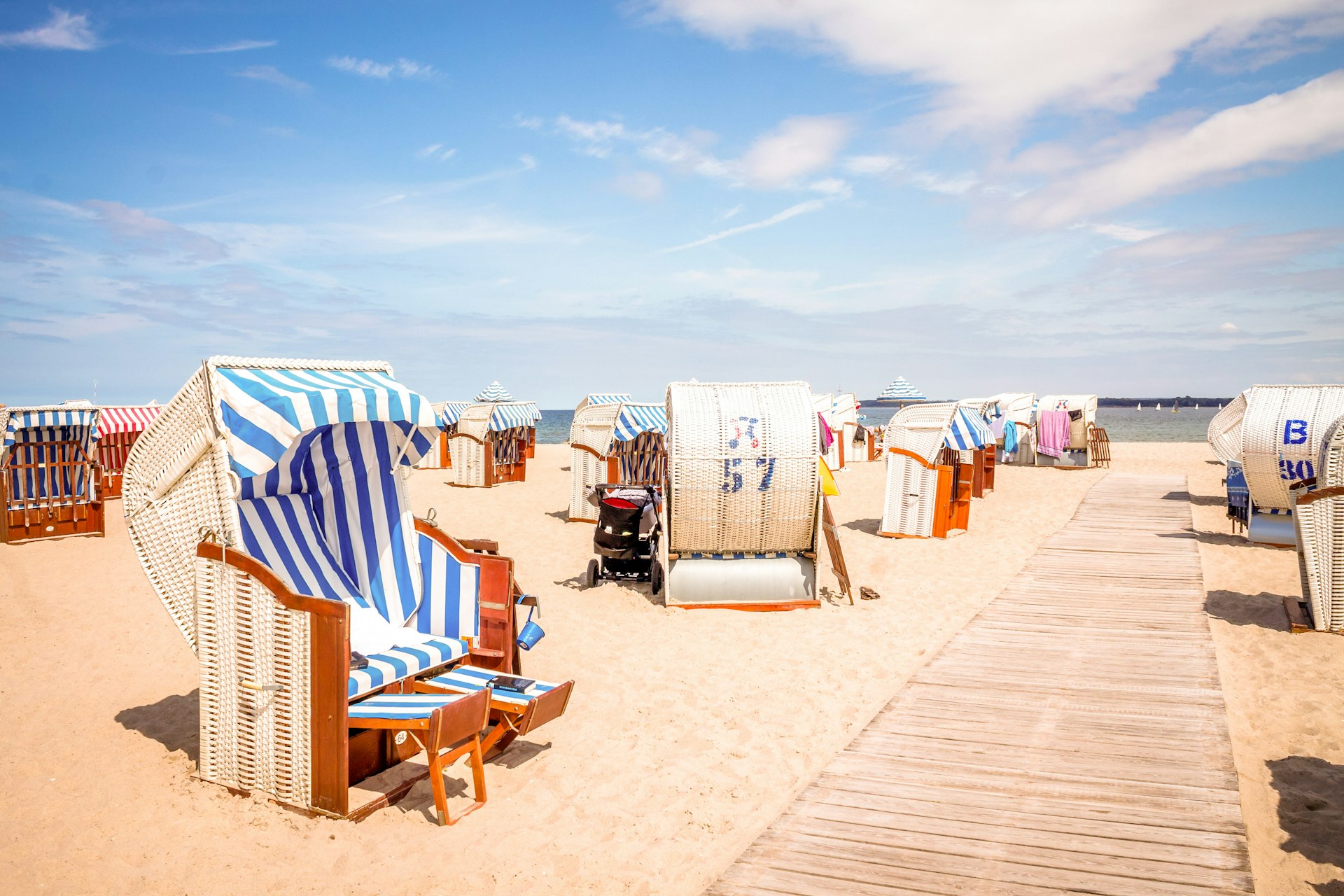 Large beach chairs on the sand at Travemuende on Germany's Baltic coast