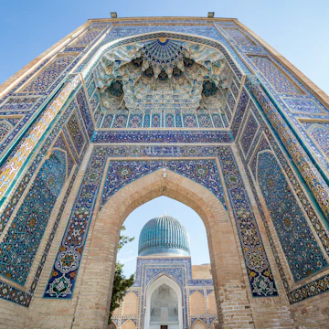SAMARKAND, UZBEKISTAN - AUGUST 28, 2016: Gur-E Amir Mausoleum, the tomb of the Asian conqueror Tamerlane or Timur, in Samarkand, Uzbekistan
571103800
amir, amir timur, ancient, architecture, art, asia, attraction, building, central asia, ceramic, city, culture, cupola, decoration, detail, dome, gur-e, gur-e amir, heritage, historic, holy, islam, islamic, landmark, madrasa, madrasah, majolica, mausoleum, minaret, monument, mosaic, mosque, muslim, old, oriental, ornament, pattern, religion, samarkand, samarqand, tamerlane, tile, timur, tomb, tourism, town, travel, unesco, uzbek, uzbekistan