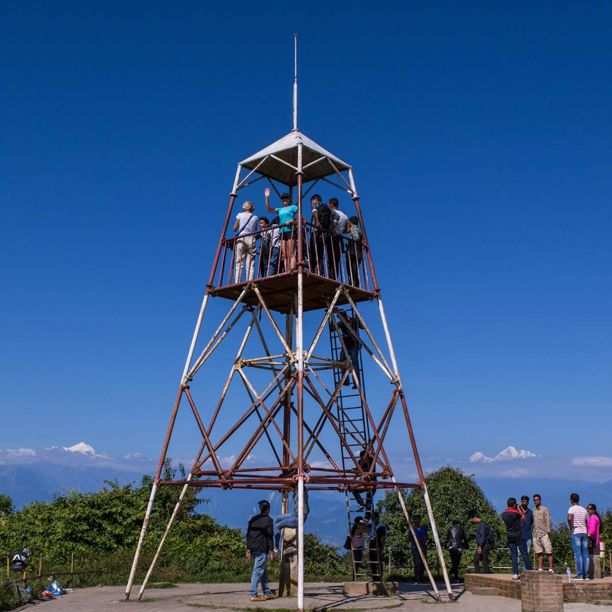 People admiring the panorama of the himalayas from Nagarkot View Tower.