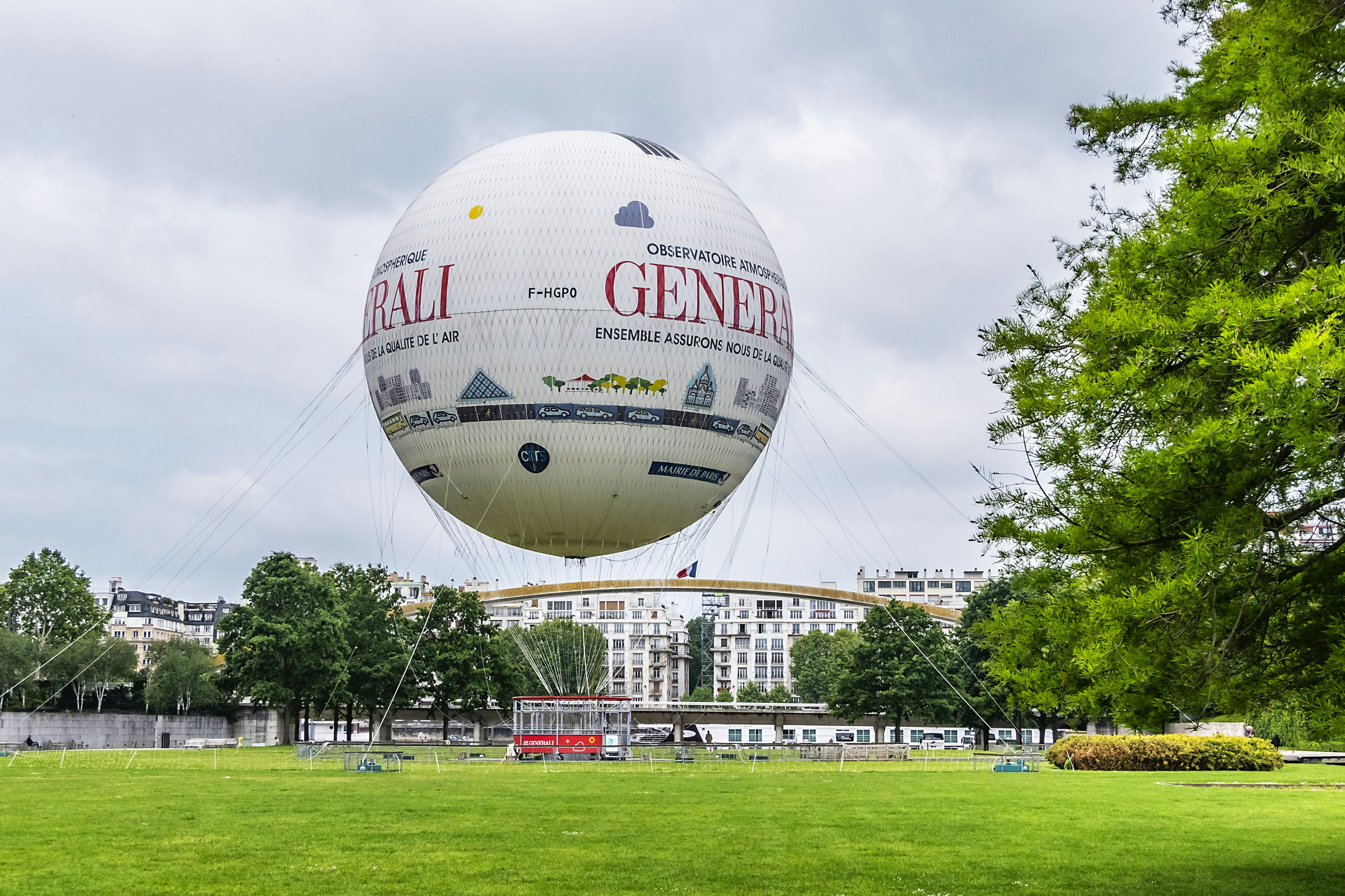 Parc Andre Citroen located on left bank of river Seine with a tethered hot air balloon, Ballon de Paris, allowing visitors to rise above the Paris skyline.