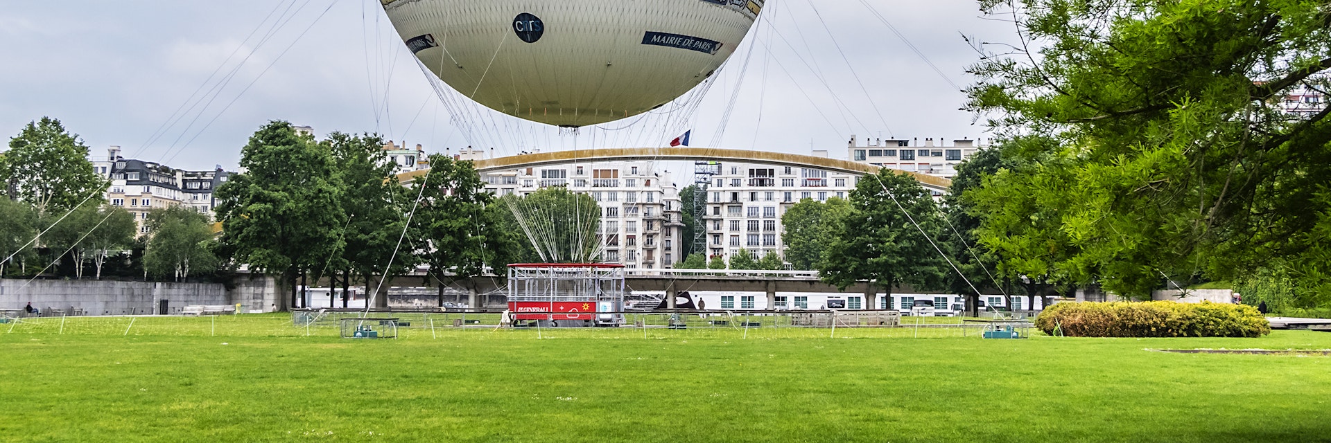 Parc Andre Citroen located on left bank of river Seine with a tethered hot air balloon, Ballon de Paris, allowing visitors to rise above the Paris skyline.