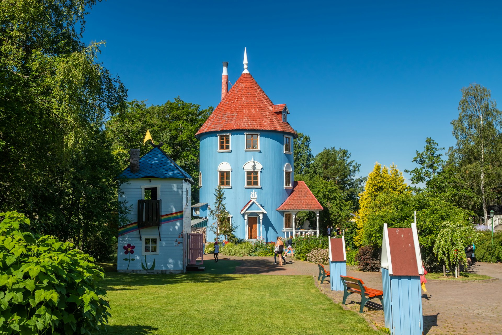 Visitors at Moominhouse in park Moominworld, Finland