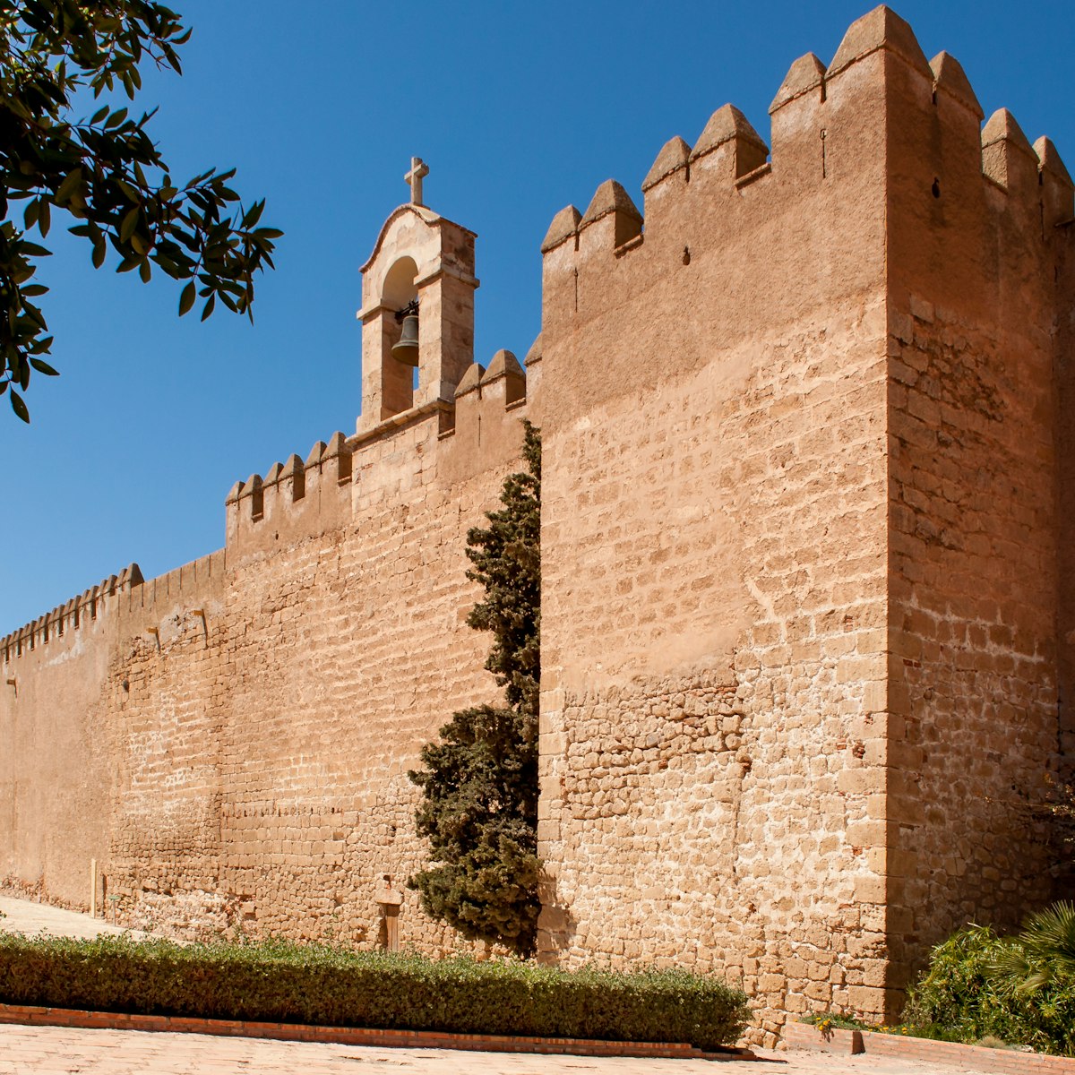 The sail wall with its bell, which separates the first and second enclosures of the fortress in Alcazaba, Almeria, Spain.