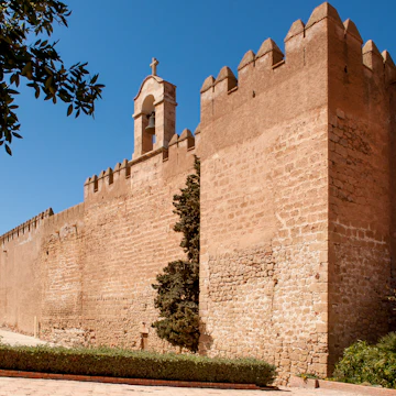 The sail wall with its bell, which separates the first and second enclosures of the fortress in Alcazaba, Almeria, Spain.