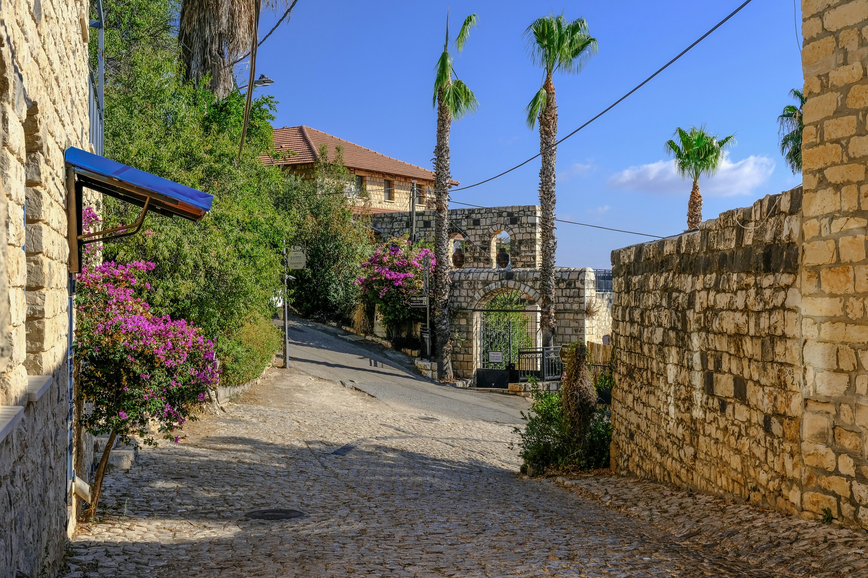 Cobbled street with rebuilt old stone houses in Old Town Rosh Pina.