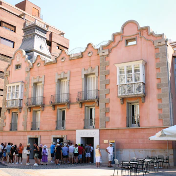Visitors in front of the Roman Theater Museum in Cartagena, Spain.