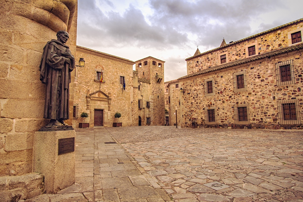 Plaza de Santa Maria and statue of San Pedro de Alcantara near the Cathedral of St. Mary, Caceres, Spain.