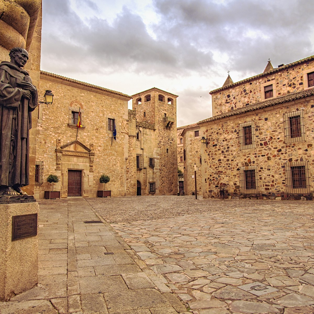 Plaza de Santa Maria and statue of San Pedro de Alcantara near the Cathedral of St. Mary, Caceres, Spain.