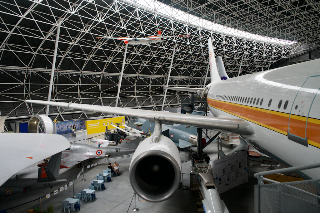 The interior of the hangar at Aeroscopia filled with planes