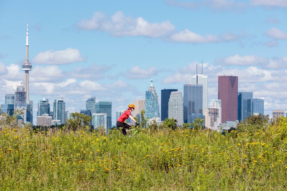 Cycling in front of the skyline from Tommy Thompson Park in Toronto Ontario Canada.