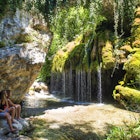 Two women looking at a little waterfall in Capelli di venere, Casaletto Spartano, Campania