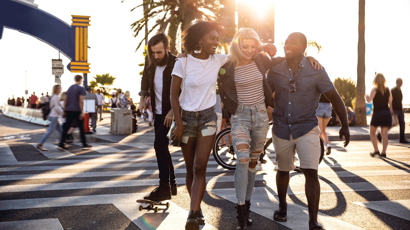 Group of friends in Santa Monica - Los Angeles - Have fun during a vacation
1159412306
A group of friend laughing as they walk along a street in Santa Monica together