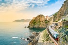 Manarola, Cinque Terre - train station in small village with colorful houses on cliff overlooking sea. Cinque Terre National Park with rugged coastline is famous tourist destination in Liguria, Italy
1167623137
5 terre