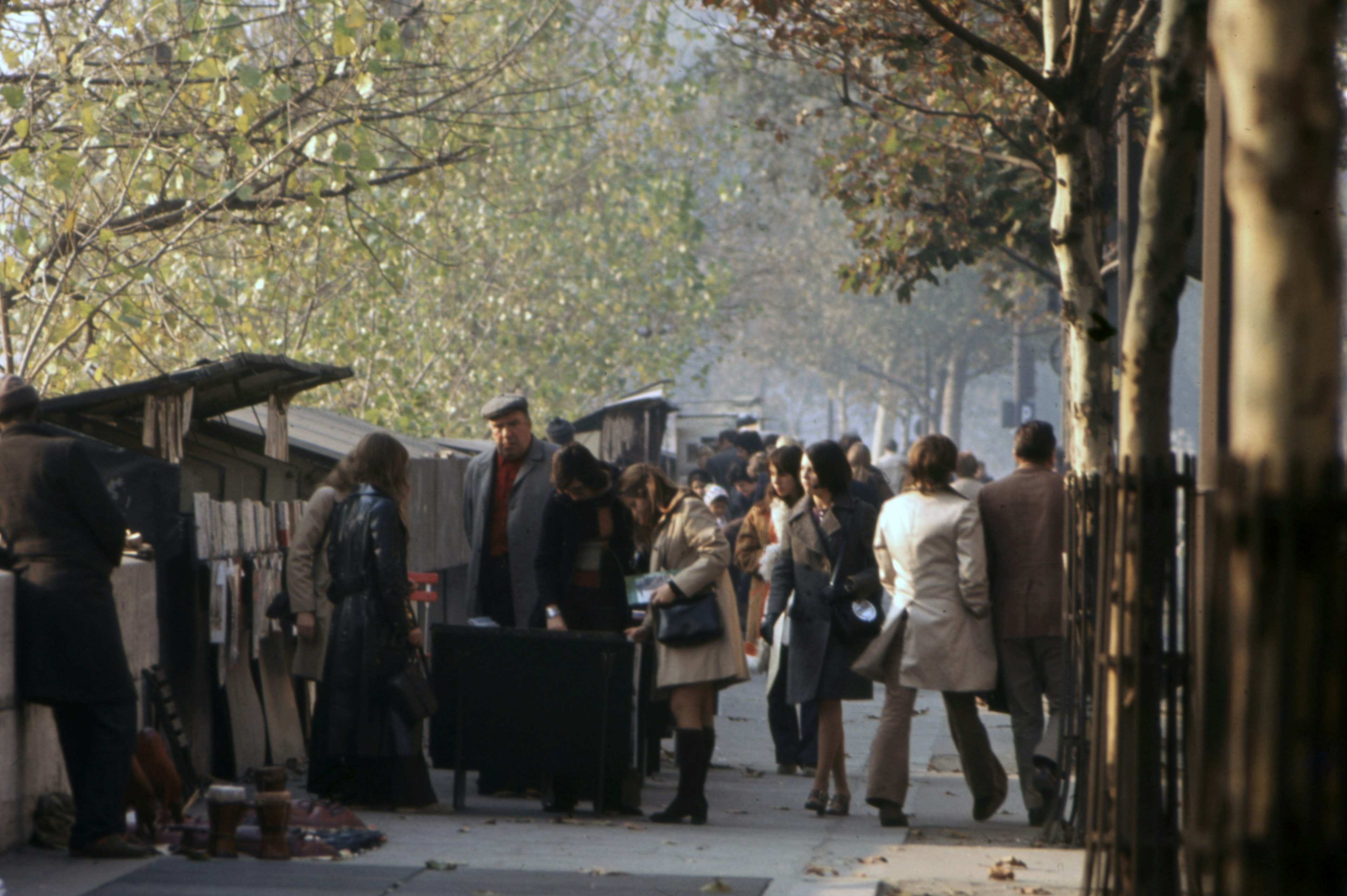 Customers browse the bookstalls of the Seine in 1970