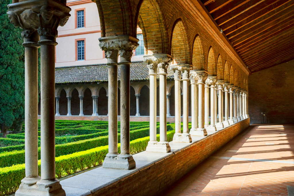 Cloisters, Couvent des Jacobins A series of cloisters - an arched covered walkway - goes around a manicured courtyard garden