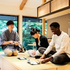 A tea ceremony experience at a Japanese guesthouse.
1419555779
Tourists learn how to drink powdered green tea during a tea ceremony in Tokyo