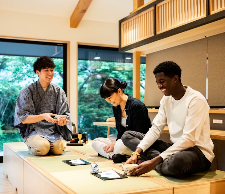 A tea ceremony experience at a Japanese guesthouse.
1419555779
Tourists learn how to drink powdered green tea during a tea ceremony in Tokyo