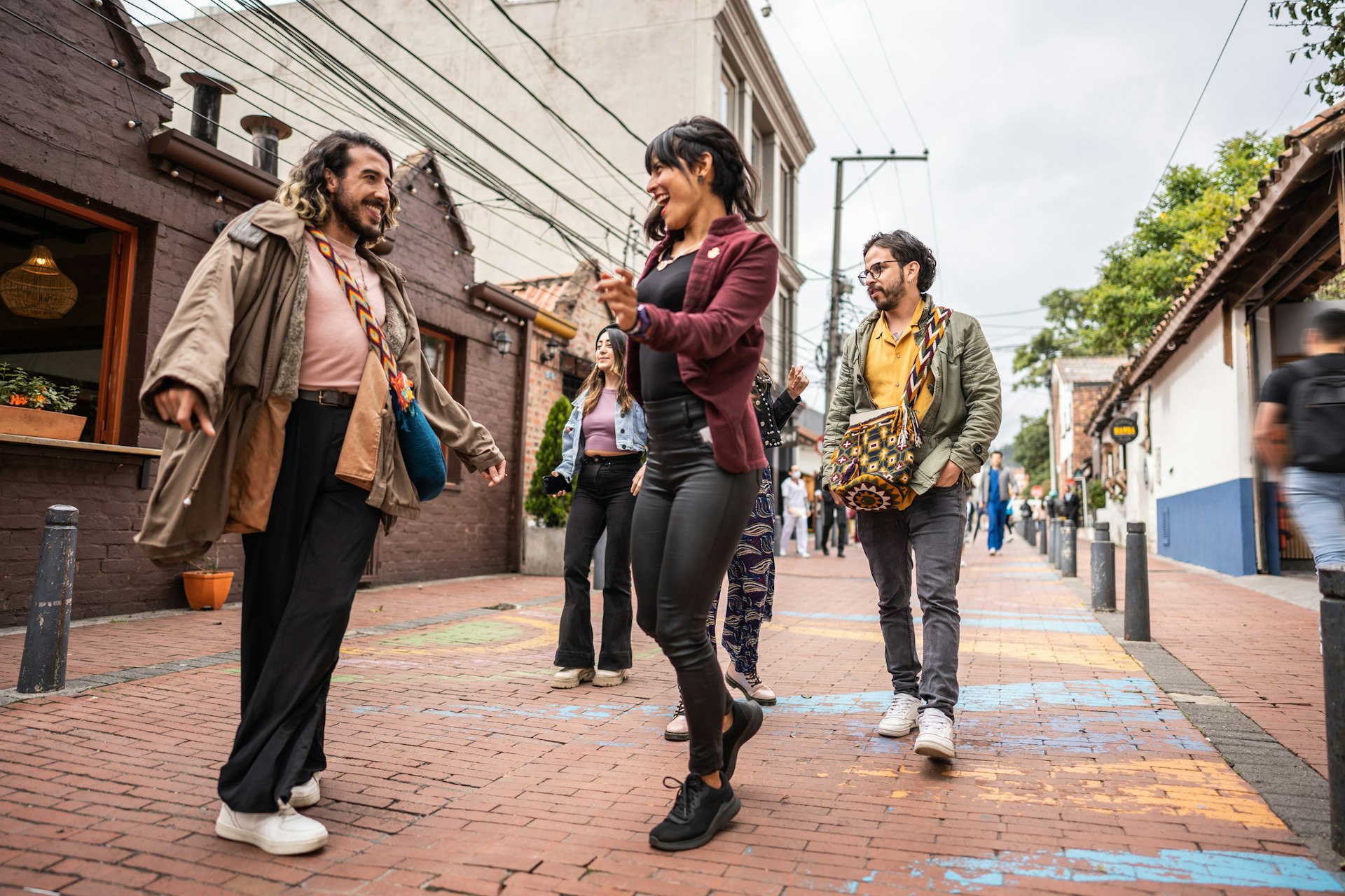 Friends dancing in the street in Bogotá, Colombia