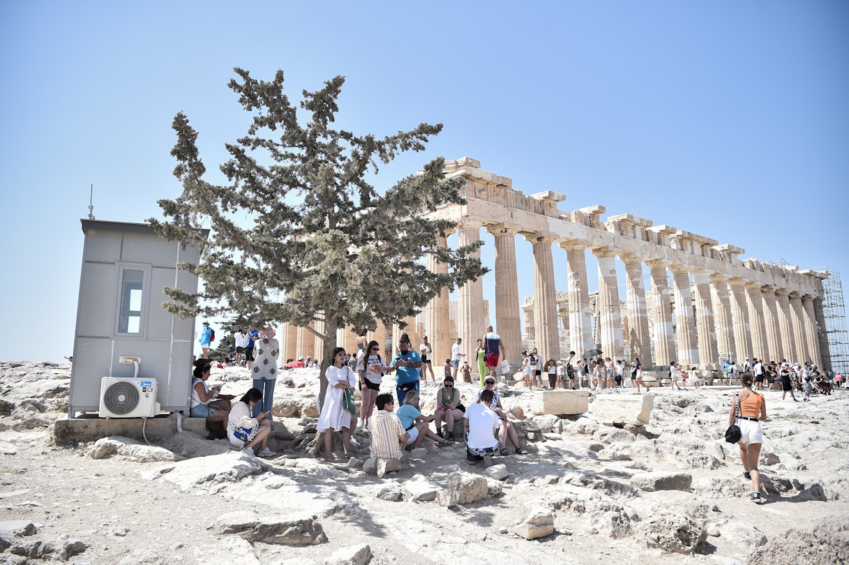 ATHENS, GREECE - JULY 20: Atop the Acropolis ancient hill with Parthenon temple in background, tourists hide from burning sun during a heat wave on July 20, 2023 in Athens, Greece. The Acropolis of Athens and other archaeological sites in Greece announced reduced opening hours due to the heatwave conditions. Parts of Europe continue to experience extreme conditions of the Cerberus heatwave, dubbed Charon. (Photo by Milos Bicanski/Getty Images)
1558046854
