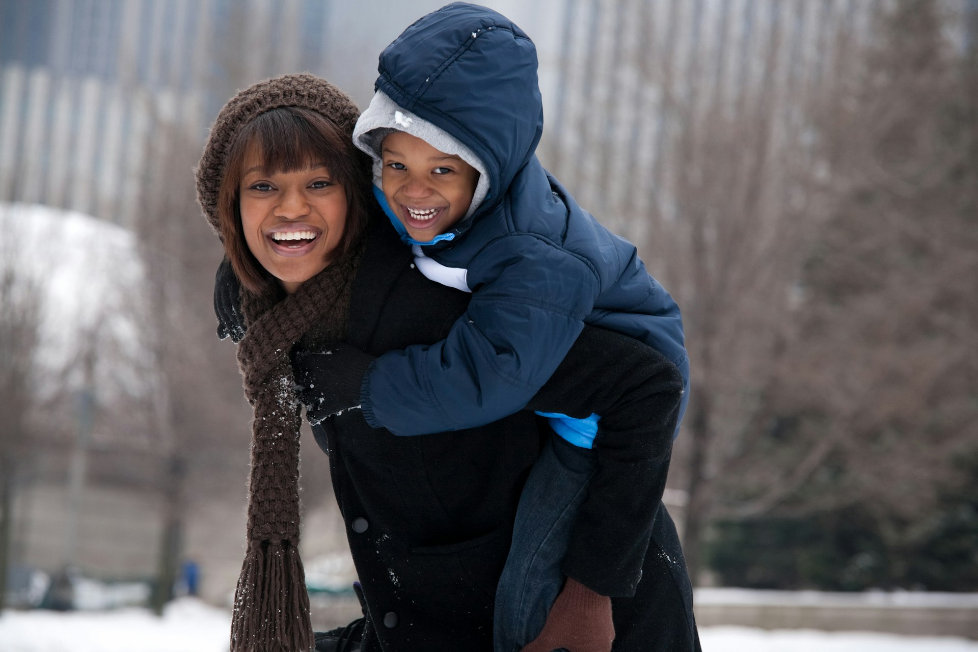 Mother and son having fun in Chicago during the winter.