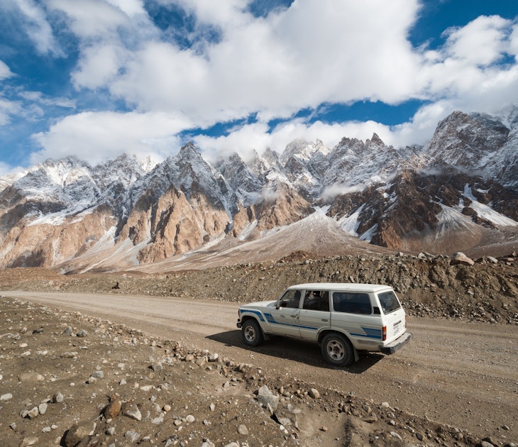 A 4WD on an empty section of the Karakoram Highway, Pakistan