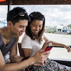 696135813
25 to 29 years, adventure travel, asian ethnicity, boat, boathouse, bonding, both male and female, cellular telephone, chinese ethnicity, cruise ship, escape, exploration, female, friendship, getting away from it all, happiness, harmony, heterosexual couple, looking down, looking, love, male, man, mekong delta, muscular, outdoors, photograph, quality time, romance, sarong, shorts, single, sitting, smiling, sunglasses, technology, three quarter length, togetherness, top, tourism, transport, travel destination, travel, two people, vacation, vehicle interior, vietnam, vietnamese culture, wearing, woman, young woman, youth culture, Mekong Delta, Vietnam
Couple looking at photo in mobile phone on cruise boat, Mekong Delta, Vietnam