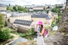 Young female traveler with photocamera enjoying beautiful cityscape view on the old town in Luxembourg city
809811716
