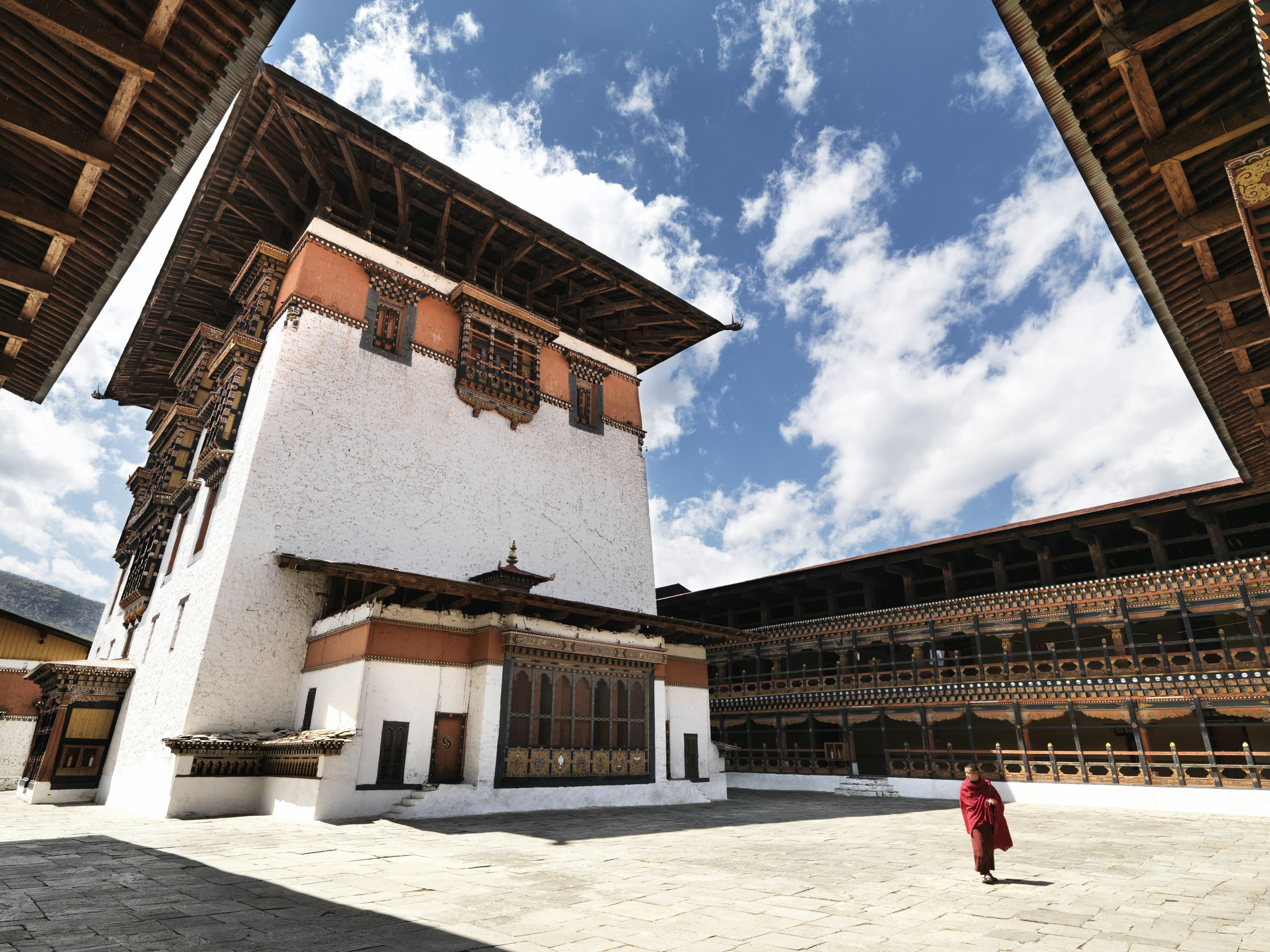 Monk in the courtyard of Paro Dzong, Bhutan