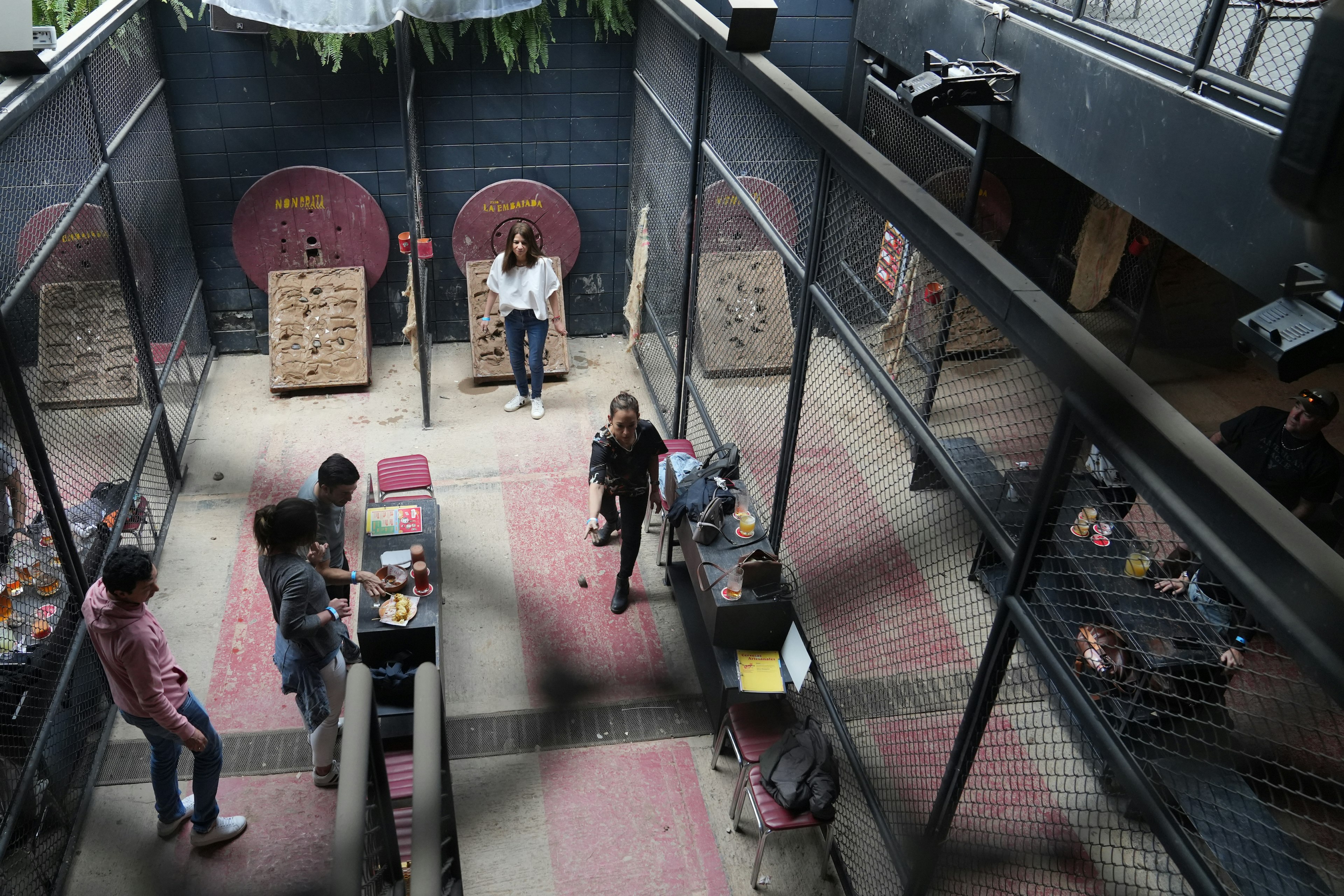 An overview of friends playing Tejo in Bogotá, Colombia