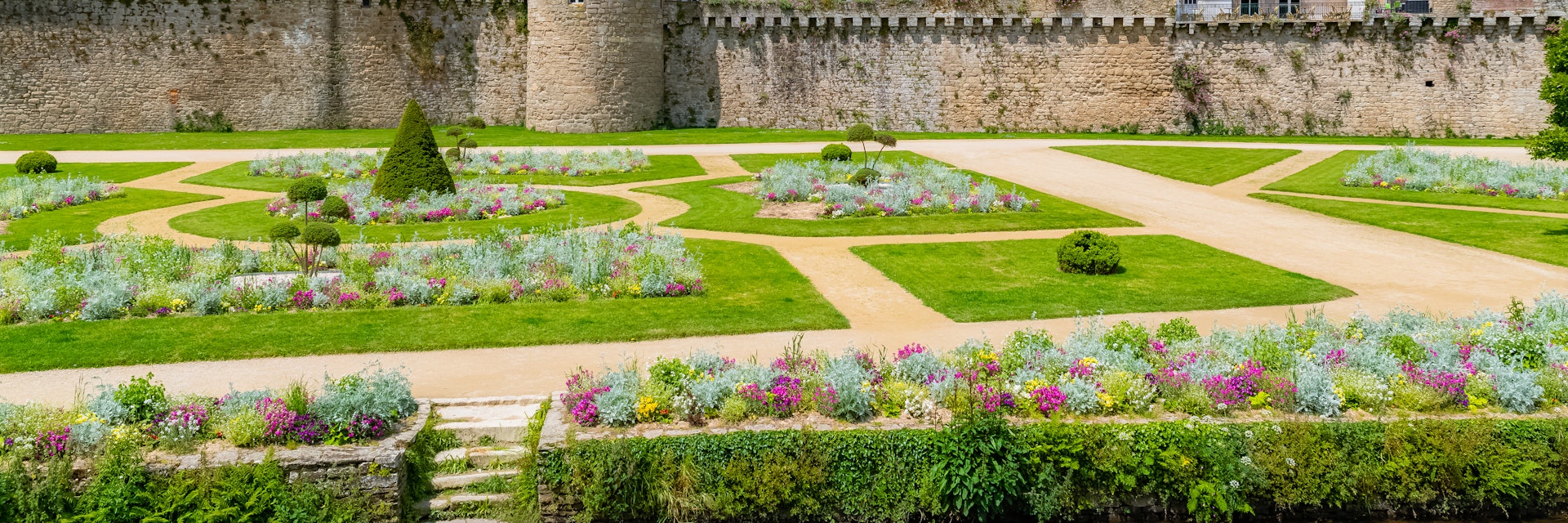 The garden of the ramparts, a public park, with the old city behind the walls in Vannes, France.