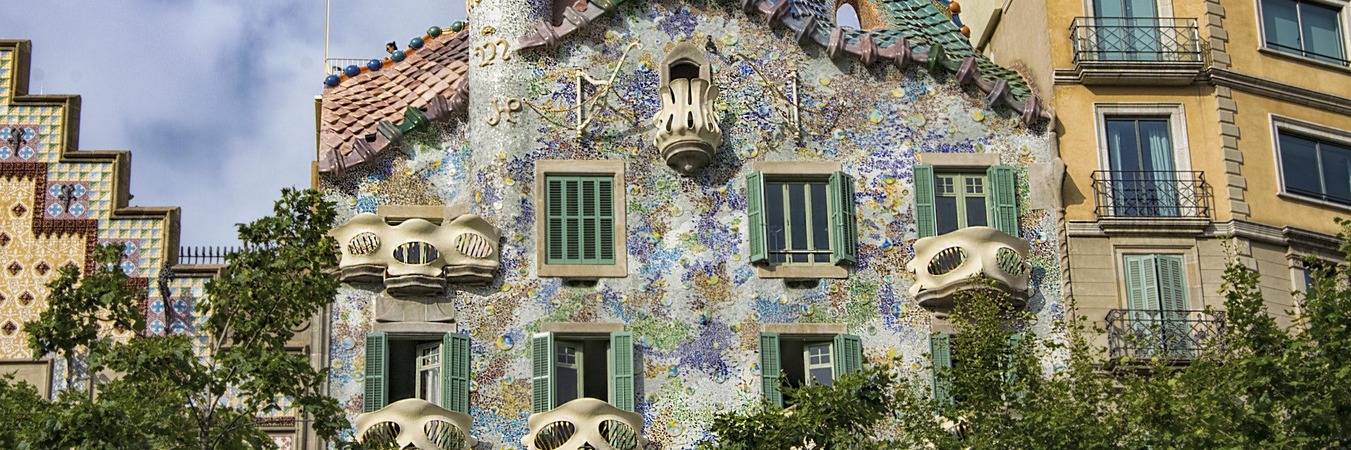 Barcelona, Casa Batlló is one of the two great buildings designed by Antoni Gaudí on Passeig de Gràcia From the outside the façade of Casa Batlló looks like it has been made from skulls and bones.