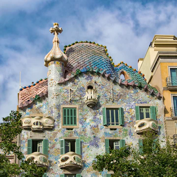 Barcelona, Casa Batlló is one of the two great buildings designed by Antoni Gaudí on Passeig de Gràcia From the outside the façade of Casa Batlló looks like it has been made from skulls and bones.