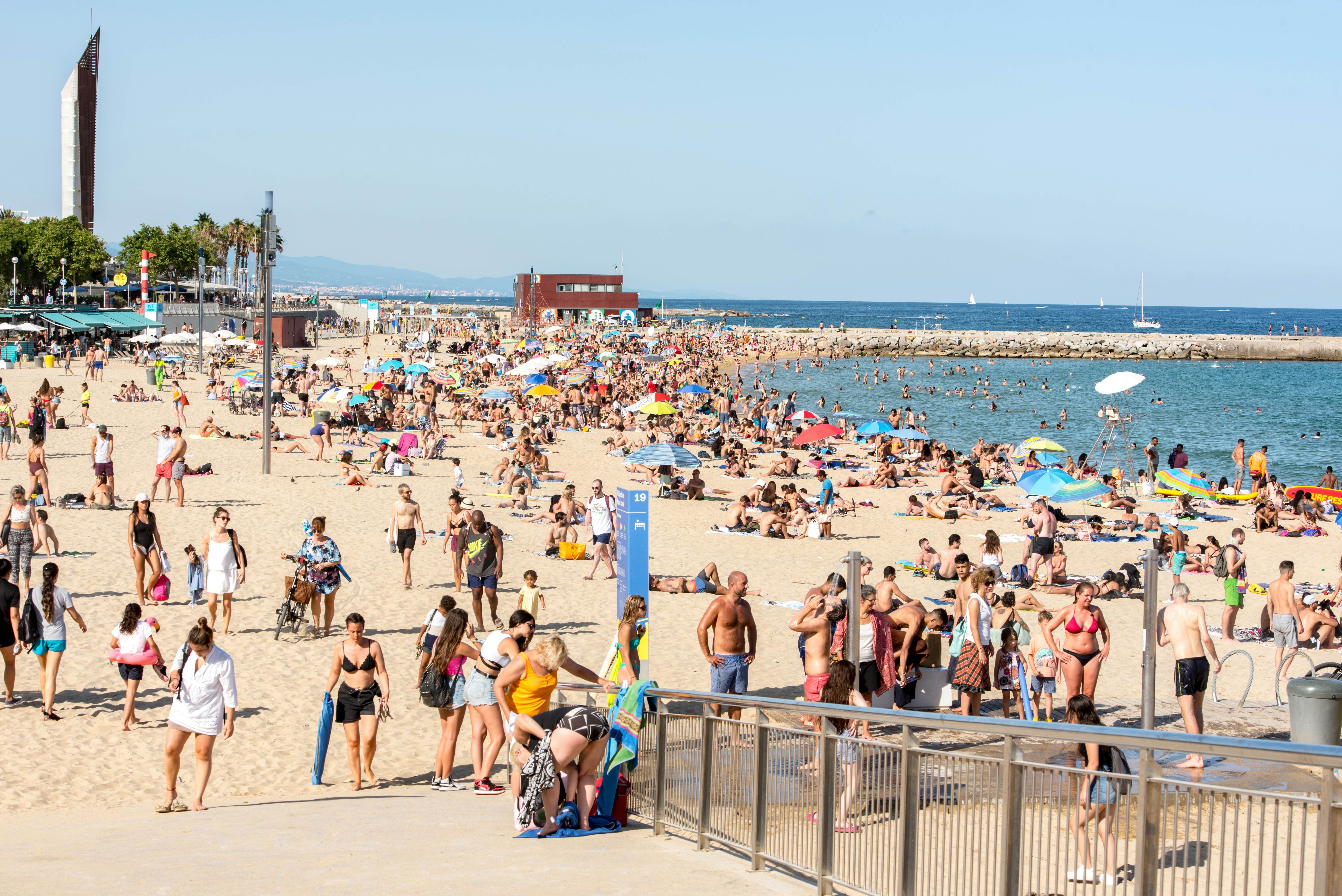 Platja de la Nova Icària beach with people in summer after COVID 19 on June 26, 2020 in Barcelona, Spain.