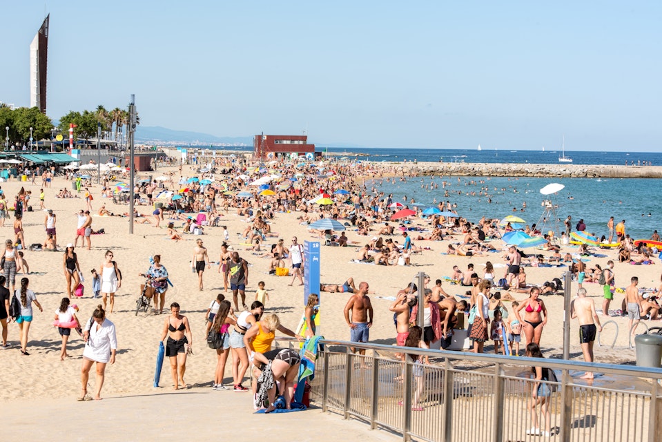 Platja de la Nova Icària beach with people in summer after COVID 19 on June 26, 2020 in Barcelona, Spain.