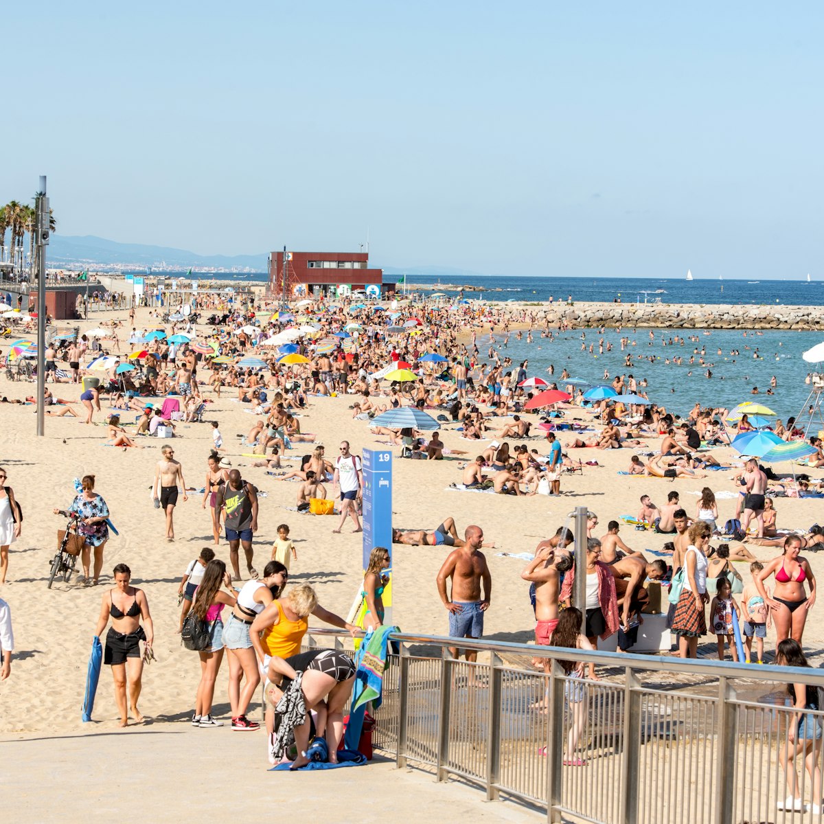 Platja de la Nova Icària beach with people in summer after COVID 19 on June 26, 2020 in Barcelona, Spain.