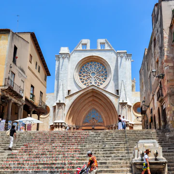 Madrid, Spain - October 05, 2019: Plenty of tourists walk in front of the statue of King Philips III at the Plaza Mayor in Madrid, Spain.