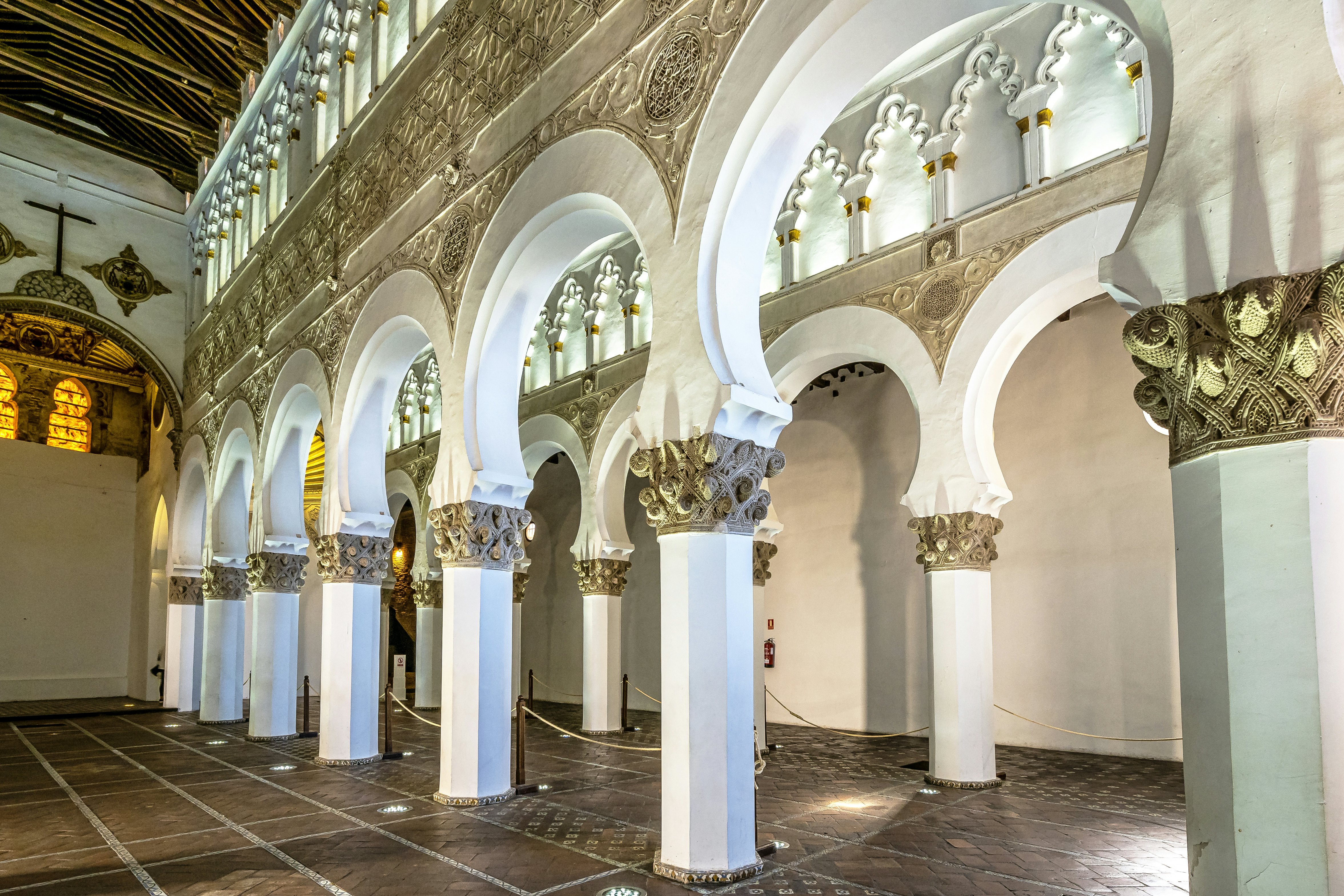 White arches at Ancient Sinagoga de Santa Maria La Blanca, Synagogue in the historical center of Toledo, Spain. Erected in 1180 and is considered the oldest synagogue building in Europe still standing.