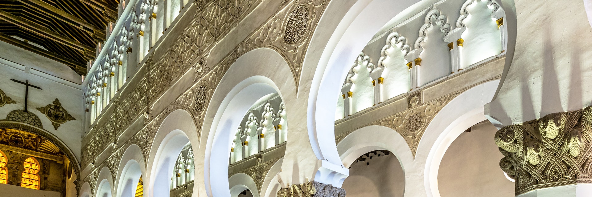 White arches at Ancient Sinagoga de Santa Maria La Blanca, Synagogue in the historical center of Toledo, Spain. Erected in 1180 and is considered the oldest synagogue building in Europe still standing.