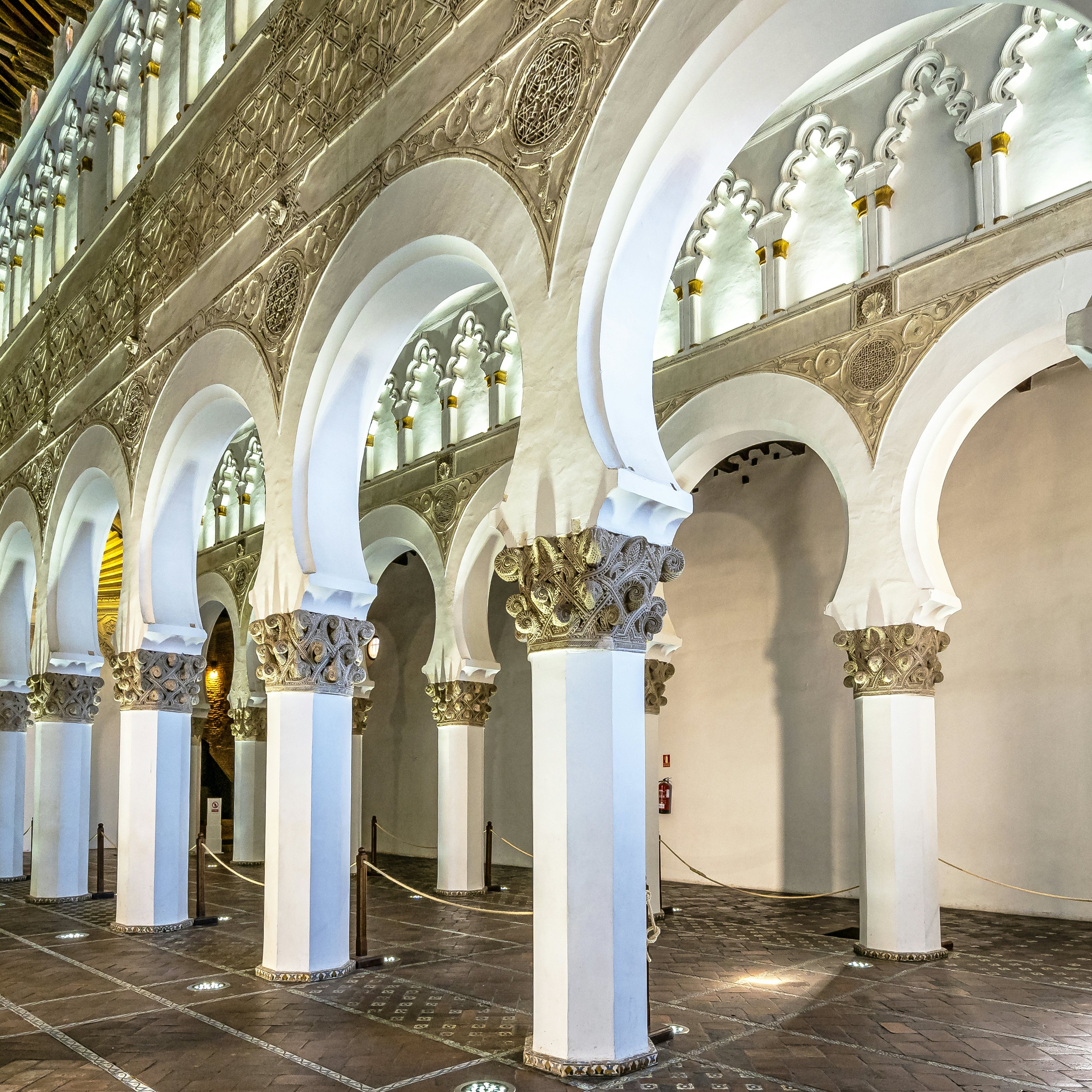 White arches at Ancient Sinagoga de Santa Maria La Blanca, Synagogue in the historical center of Toledo, Spain. Erected in 1180 and is considered the oldest synagogue building in Europe still standing.